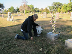 Jill Swenson at stone in cemetary